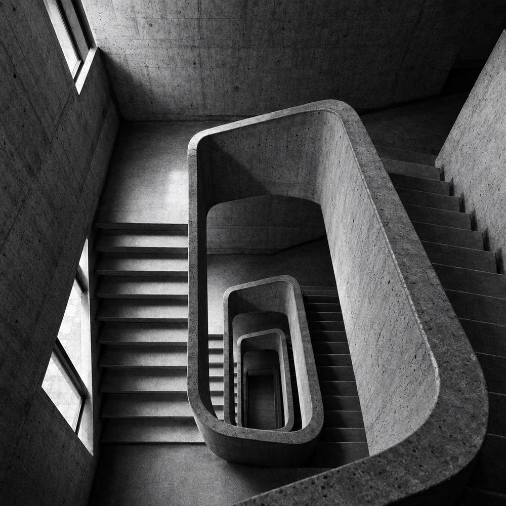 A concrete stairwell seen from above, black and white photo